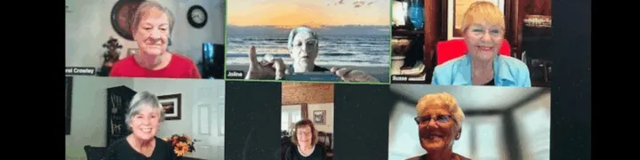 Six women participate in a virtual meeting, smiling and engaging with each other on a video call.